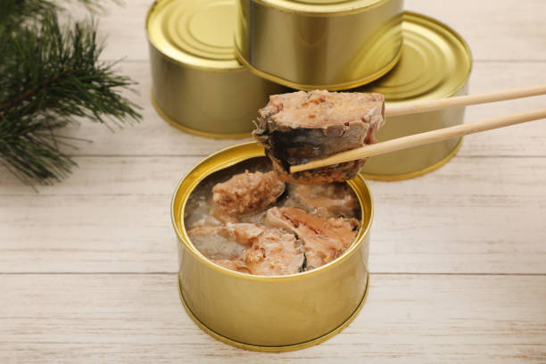 istock Opened canned mackerel and unopened canned mackerel in the background 1611984833