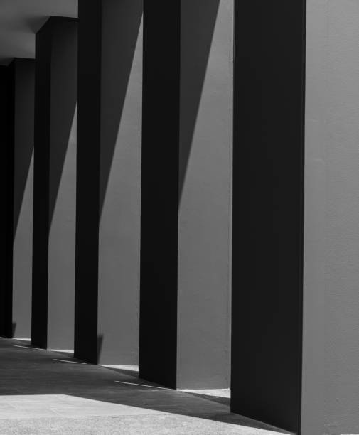 istock Dark concrete empty room The light from the sun shines on the floor as black shadows 1611992143