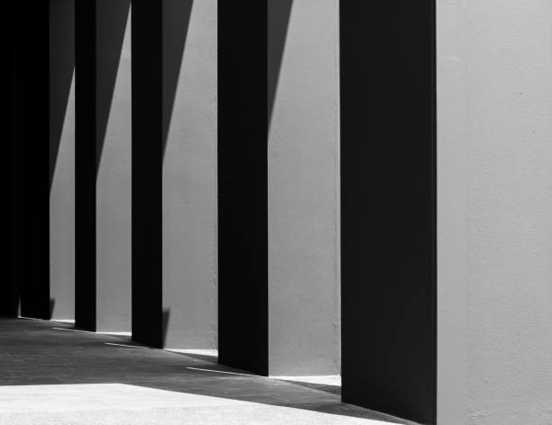 istock Dark concrete empty room The light from the sun shines on the floor as black shadows 1611992145
