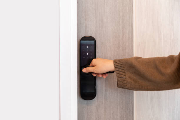 istock Hand open door digital and access control in a condo 1611992692
