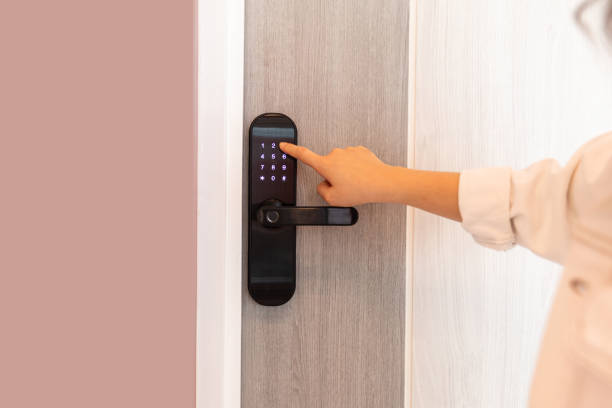 istock Hand open door digital and access control in a condo 1611992693