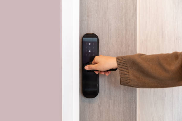 istock Hand open door digital and access control in a condo 1611992694