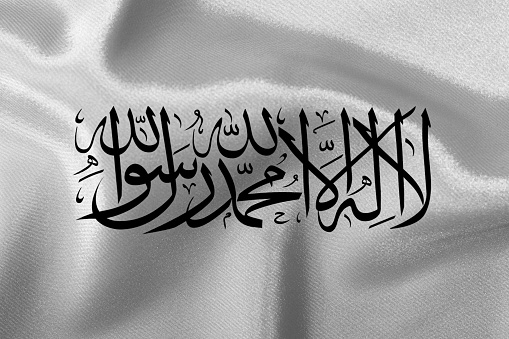 Flag of the state of Taliban close-up.