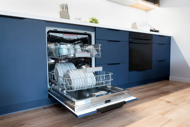 istock Dishwasher in modern kitchen. Washing dishes 1612033738