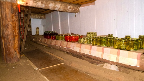 This is the basement of a grandmother in the village, she prepares cucumbers, tomatoes, zucchini, peppers for the winter