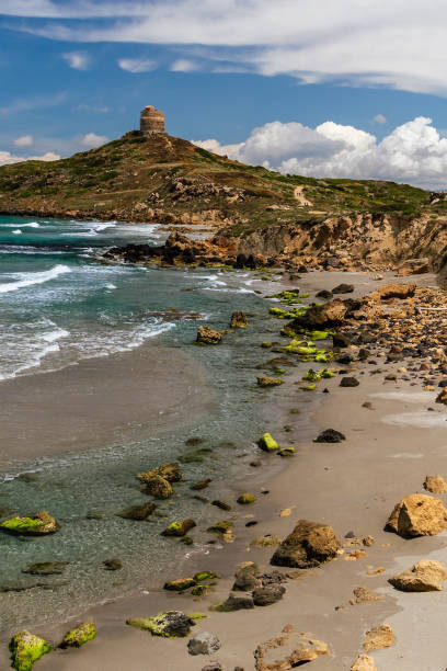 Rocky coastline with medieval tower stock photo