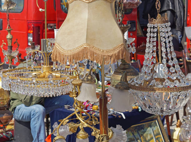 Many lamps shades and crystal chadeliers for sale at flea market