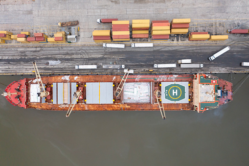 Aerial top view large general cargo ship bulk carrier.
