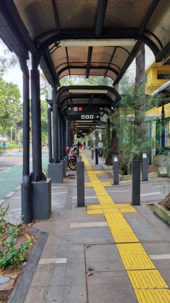 istock Guiding Block along the bus stop in Jakarta 1612078268