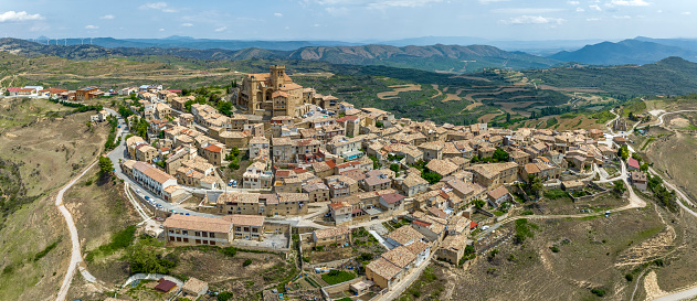 Panoramic aerial view of the hilltop medieval village of Ujue in Navarra, northern Spain on ancient pilgrim route Camino de Santiago or Way of St James. Nominated Pretty Town