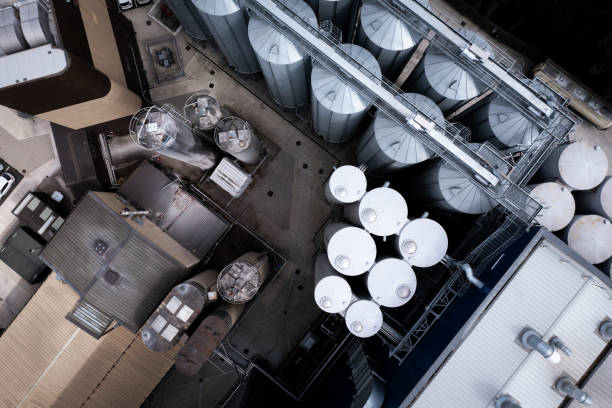 istock Aerial view directly above food processing plant or chemical storage cylinders 1612085230