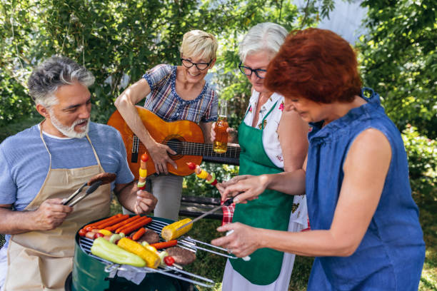 istock Elderly people have a great time on a picnic 1612116751