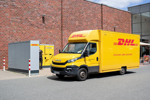 Schleswig, Germany - June 15, 2022: DHL Iveco Daily van at Packstation