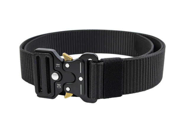 istock Black belt with strong metal buckle close-up on white 1612125909