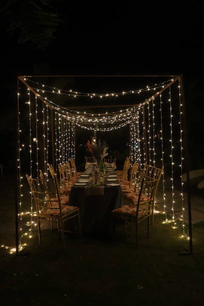 istock Decorated dining area for dinner with beautiful lighting 1612134485