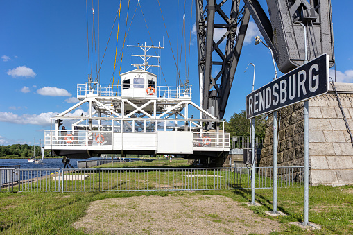 Osterrönfeld, Germany - June 12, 2022: hanging ferry under the Rendsburg High Bridge in Schleswig-Holstein, Germany