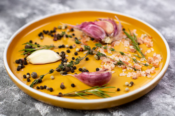 istock Orange round plates with spices and condiments, mockup for menu 1612162382