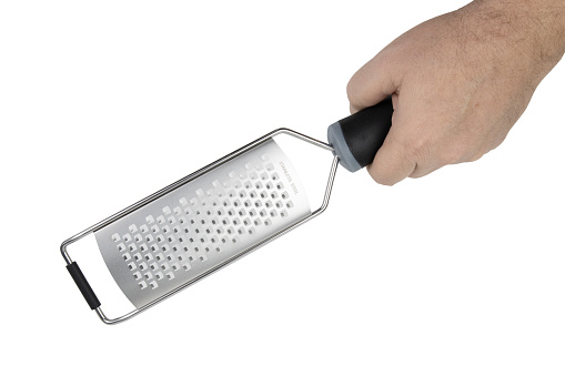 Cheese grater in hand isolated on white, top view, cheese accessories