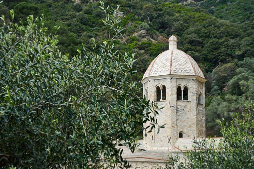 The bell tower of Abbey of San Fruttuoso, one-time Benedictine monastery built in the 10th century. It's located on the italian riviera between Camogli and Portofino. The abbey can only be reached by sea or by hiking trails. Camogli. Genova. Italy.