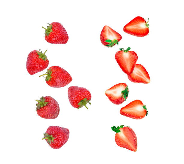 istock Strawberry falling in the air isolated on white 1612202480