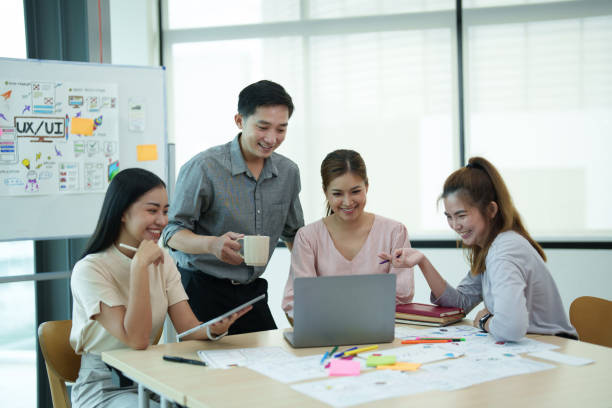 istock Group of asian creative teamwork discuss at business meeting for developing mobile phone app project, ux, ui start up, small business concept 1612241185