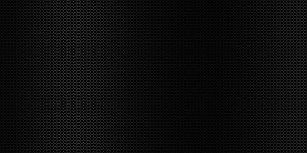istock Abstract black perforated metal background texture 1612278102