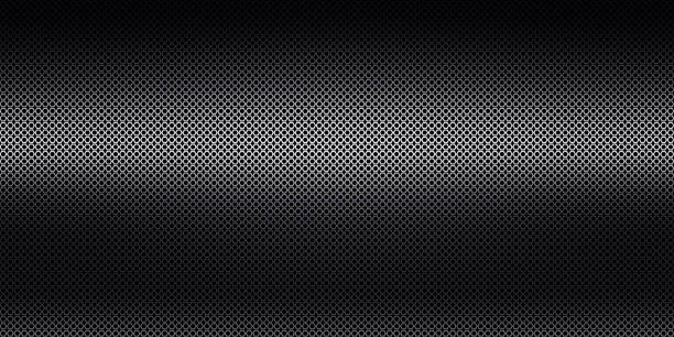 istock Abstract black perforated metal background texture 1612279188