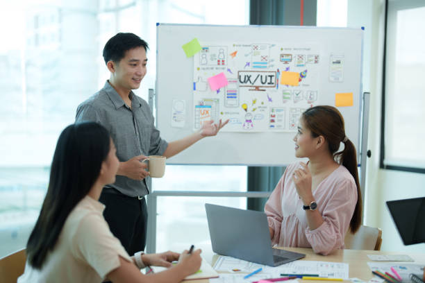 istock Group of asian creative teamwork discuss at business meeting for developing mobile phone app project, ux, ui start up, small business concept 1612283076