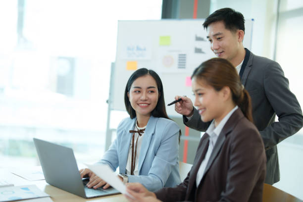 istock Group of business people sitting around a table and talking. 1612288455