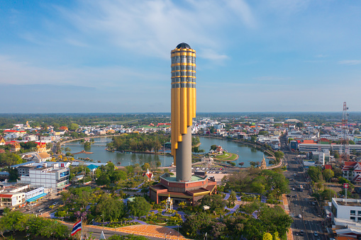 Aerial view of Roi Et tower, tourist attraction landmark. Urban housing development from above. Top view. Real estate in city, Thailand. Property real estate.