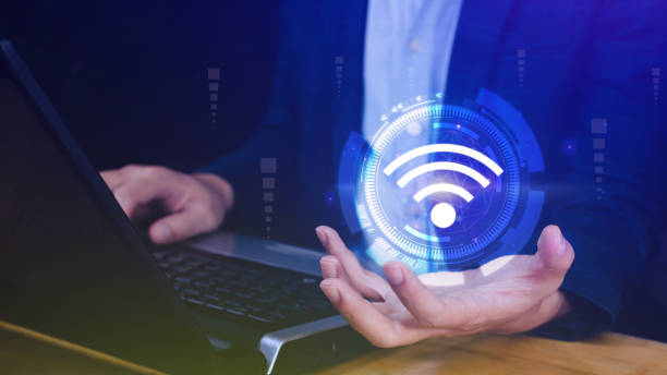 istock Businessman using holding with wifi icon. Social network business communication concept, Wifi wireless concept free network Internet concept. 1612342820