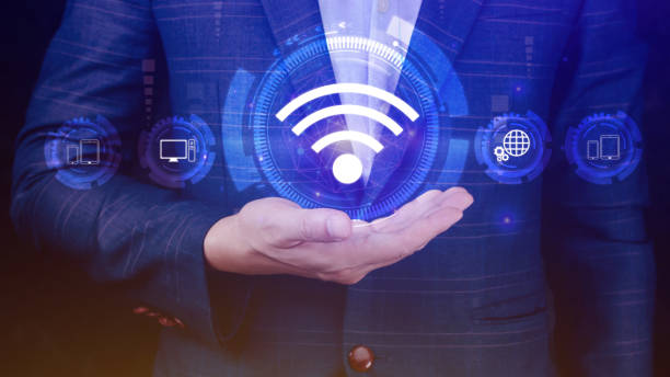 istock Businessman using holding with wifi icon. Social network business communication concept, Wifi wireless concept free network Internet concept. 1612342873