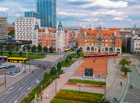 Krakow, Poland - May 22, 2023: People going at Main Market Square in Krakow in a summer day, Poland