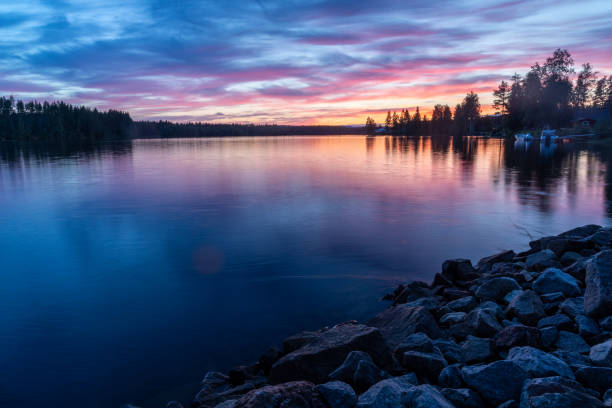 istock Blue and pink sunset over the lake 1612391508