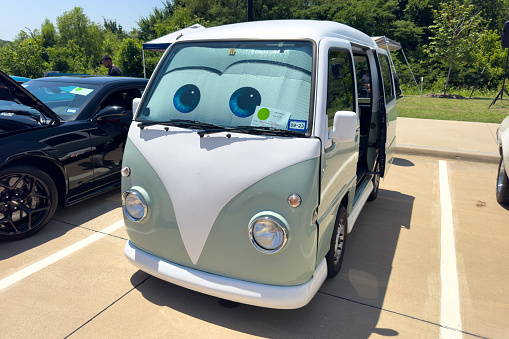 Little Elm, Texas - June 11, 2023: An old Volkswagen camper van parked in car park.