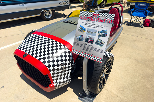 Little Elm, Texas - June 11, 2023: Vanderhall Venice three-wheeled vehicle can be considered motorcycle or racy sports car.