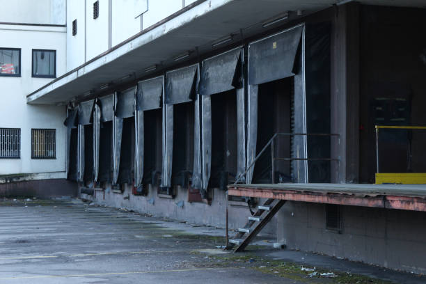 istock Truck unload docks at a warehouse 1612424878