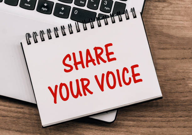 istock SHARE YOUR VOICE - inscription on notepad on laptop keyboard. 1612433009