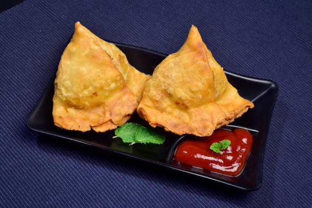 istock Samosa with ketchup in plate indian snacks 1612439268