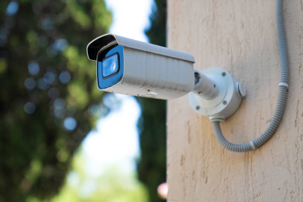 istock Surveillance camera on the street. Street security tracking. 1612441393