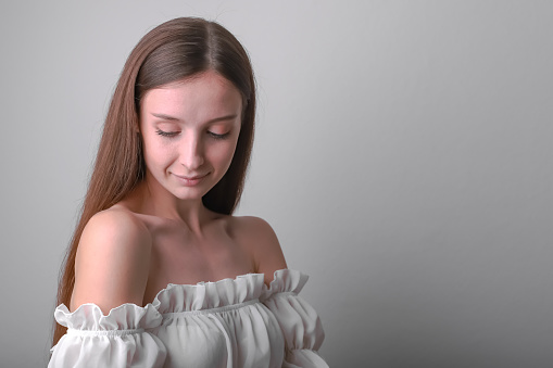 Simple Slavic beauty: Girl with untamed hair in studio portrait