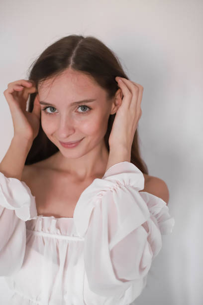 Serene Slavic maiden: Natural beauty against monochromatic canvas