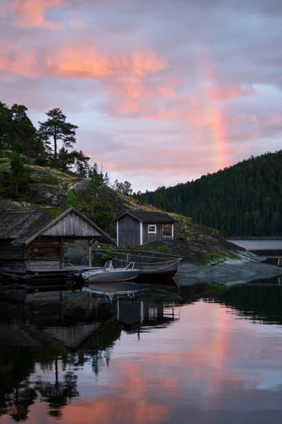 istock landscape with rainbow and sunset 1612525299
