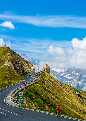 Grossglocker High Alpine Highway, Austria - July 30, 2018: A Mountain biker travels on the famous Grossglockner High Alpine Road
