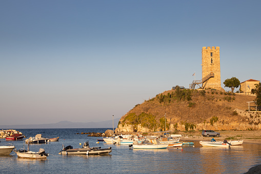 The Byzantine tower of Nea Fokea port in Kassandra peninsula, in Halkidiki region of Greece, at dusk