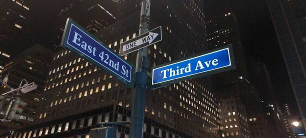 istock Street signs at night 1612567283