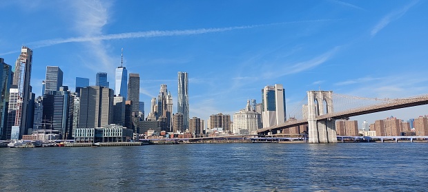 This image shows the Skyline of Low Manhattan from Brooklyn Heights and the Brooklyn bridge on the right.