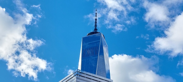New York, NY, USA - March 22, 2016: One World Trade Center and a wing of World Trade Center Transportation Hub: World Trade Center Transportation Hub  is a terminal station in Lower Manhattan for PATH rail service: One World Trade Center is the main building of the rebuilt World Trade Center complex in Lower Manhattan, New York City.