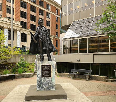 Juneau, Alaska, USA - July 12, 2023:  Statue of William Seward, by  artist Dave Rubin. Secretary of State, with the 1867 Treaty of Cession for the sale of Alaska from the Russian Empire, then known as Seward's Folly.