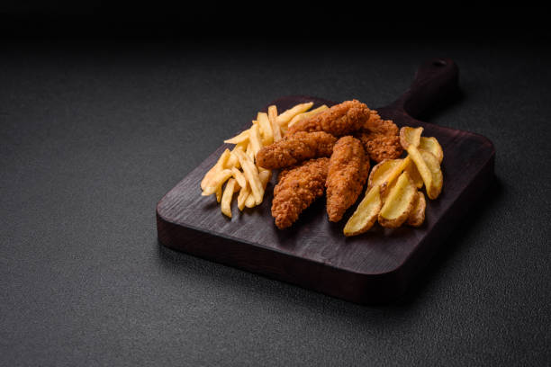 istock Delicious crispy chicken nuggets breaded with salt and spices 1612620252